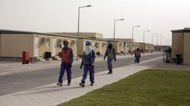 In this Sunday, May 3, 2015 photo taken during a government organized media tour, laborers head back to their housing at the end of their workday, in Doha, Qatar. (AP)