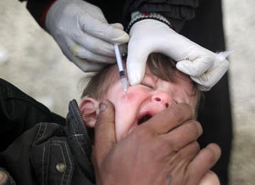 A doctor treats a child showing symptoms of leishmaniasis at a hospital in Aleppo, February 11, 2013. (Reuters)