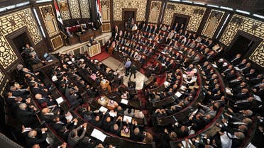 A general view shows the Syrian Parliament members listening to Syria's president Bashar al-Assad while he talks on the podium in Damascus, Syria in this handout picture provided by SANA on June 7, 2016. (SANA/Handout via Reuters)