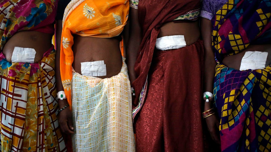Indian women pose for picture after having undergone express surgery