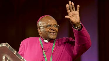 The former Anglican archbishop of Cape Town Desmond Tutu waves after receiving the 2013 Templeton Prize at the Guildhall in central London on May 21, 2013. South African anti-apartheid campaigner Desmond Tutu won the 2013 Templeton Prize worth $1.7 million for helping inspire people around the world by promoting forgiveness and justice, organisers said. REUTERS