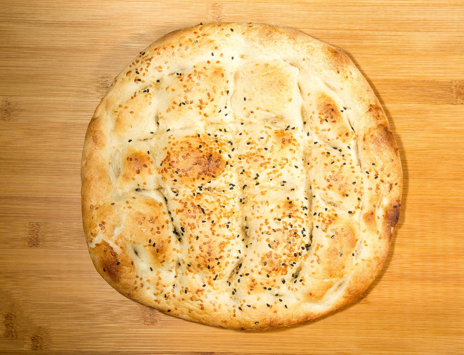 Turkish bread, or known locally as Pide Ekmeği, is a thick flat bread used with kababs and stew dishes. (Shutterstock)