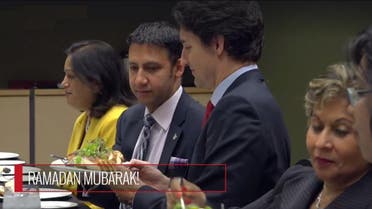Trudeau can be seen digging into Middle Easter and Asian dishes like Hummus, stuffed vine leaves and dates. (Twitter)