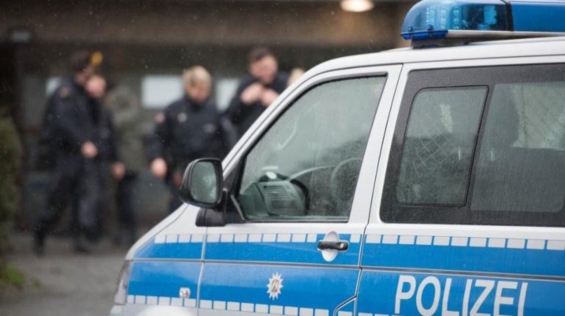 A police car stands outside a refugee shelter on February 4, 2016 in Germany. AFP
