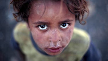 A displaced boy poses for a photo at a camp for internally displaced people in the outskirts of Sanaa, Yemen, Wednesday, June 8, 2016 (Photo: AP)