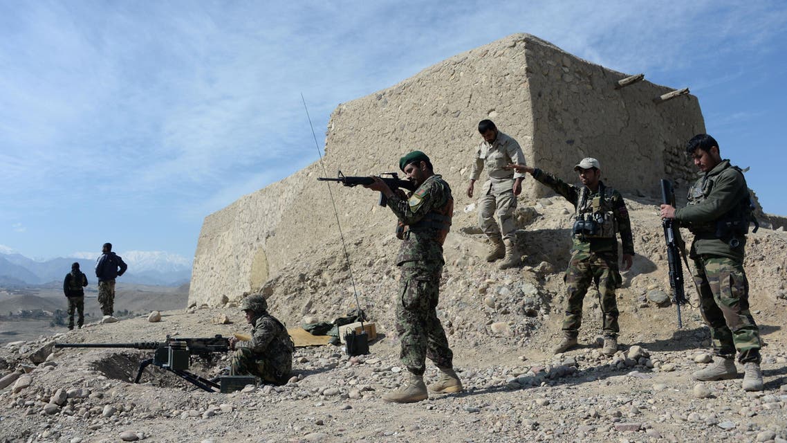 In this photograph taken on February 17, 2016, Afghan security forces patrol following an operation against Islamic State (IS) militants in Achin district in Nangarhar province. afp