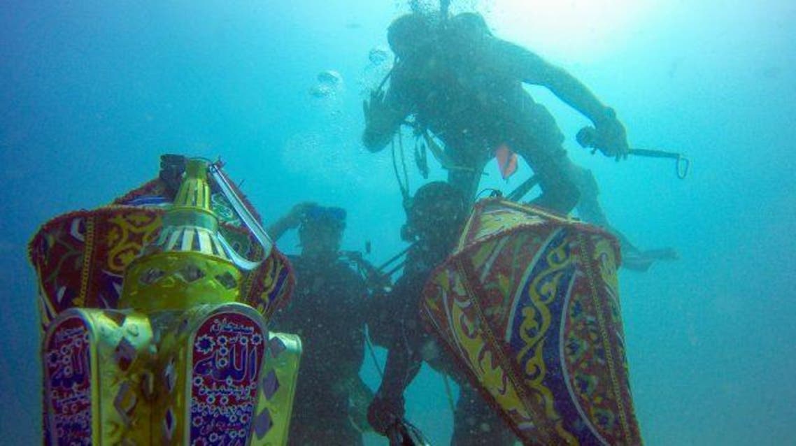 Yaheya Ashfaq, Umer Jan and Qazi Ajmal even took lanterns for a full celebration under water. (Saudi Gazette)