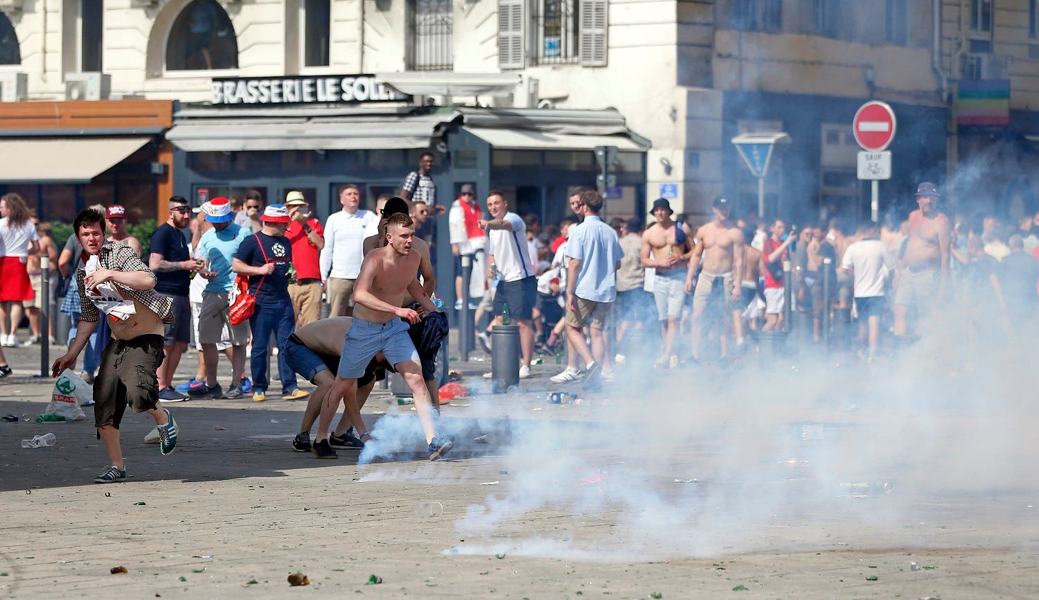 Teargas is fired at England supporters in downtown Marseille, France, Saturiday, June 11, 2016. Two nights of clashes between England supporters, French police and locals have marked the build up to Saturday's Euro 2016 soccer Championship match between England and Russia. (AP)
