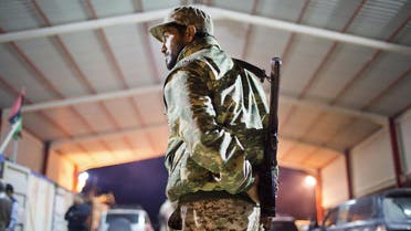 In this Wednesday, Feb. 18, 2015 file photo, a Libyan military soldier stands guard at the entrance of a town, 110 kilometers (68 miles) from Sirte, Libya. From east and west, the forces of Libya's rival powers are each moving on the city of Sirte, vowing to free it from the hold of the Islamic State group. The danger is they could very well fight each other as well. Rather than becoming a unifying cause as the United States and Europe have hoped, the fight against the jihadi group threatens to cause greater fragmentation in Libya, which has been torn apart among rival militias, tribes, governments and parliaments since the 2011 downfall of longtime autocratic ruler Moammar Gadhafi in a NATO-backed rebellion. (AP)