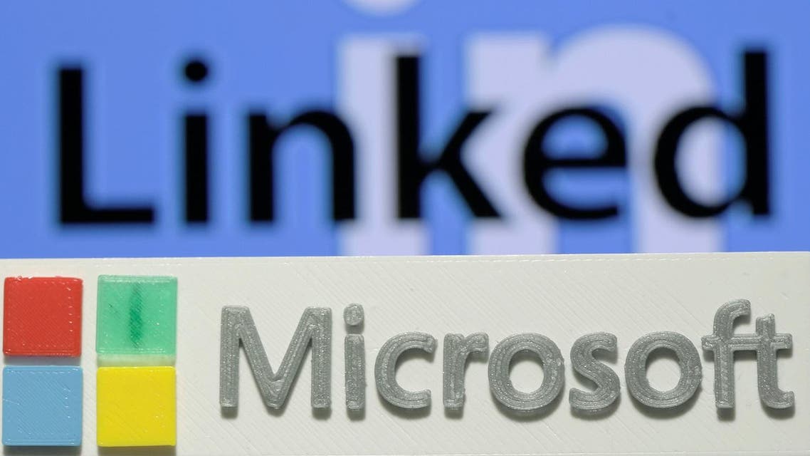 A 3D printed logo of Microsoft is seen in front of a displayed LinkedIn logo in this illustration taken June 13, 2016. REUTERS/Dado Ruvic/Illustration