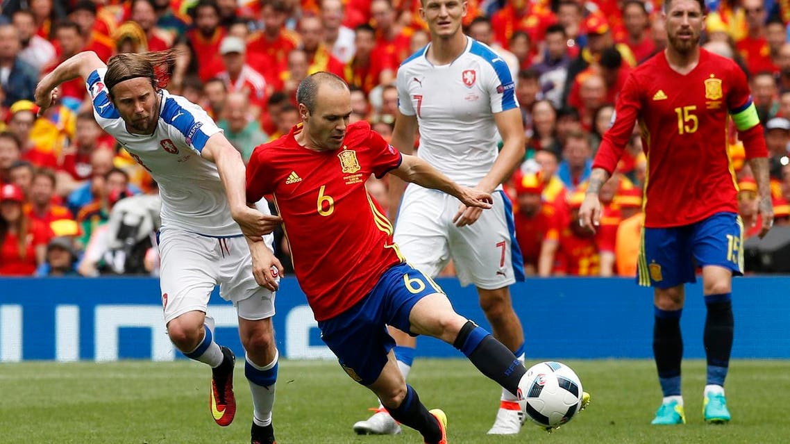 Spain's Andres Iniesta in action with Czech Republic's Jaroslav Plasil REUTERS