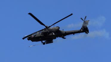 A U.S. Apache helicopter fires as it takes part in the "Saber Strike" NATO military exercise in Adazi, Latvia, June 13, 2016. REUTERS/Ints Kalnins