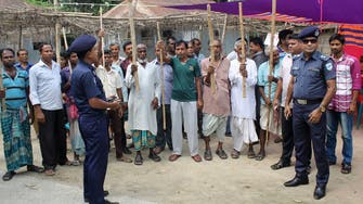 Bangladesh police give villagers bamboo sticks to fend off militants 