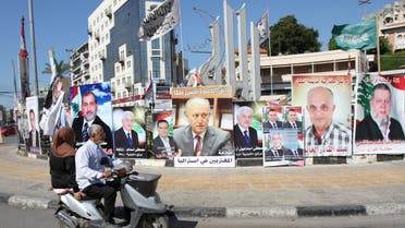 A poster depicting Sunni politician Ashraf Rifi (C) is seen among posters of Lebanese candidates that were running in Tripoli's municipal and mayoral elections, Lebanon, May 30, 2016. REUTERS