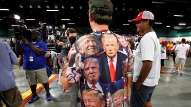 A supporter of Republican presidential candidate Donald Trump wears a shirt emblazoned with images of the politician as he is interviewed at a campaign rally in Greensboro, North Carolina on June 14, 2016. (Reuters)