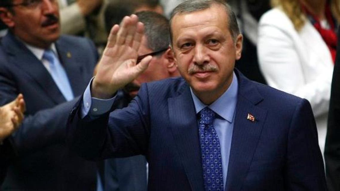 Turkish Prime Minister Recep Tayyip Erdogan greets members of parliament from his ruling AK Party (AKP) during a meeting at the Turkish parliament in Ankara on May 7, 2013. (AFP)