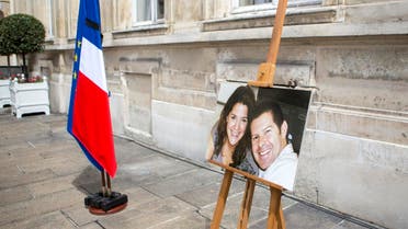 A picture taken on June 15, 2016 at the Ministry of Interior in Paris during a memorial ceremony shows a photograph of French policeman Jean-Baptiste Salvaing and his partner Jessica Schneider. (File photo: AFP)