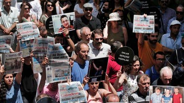 Protesters demonstrate against the jailing of two journalists and an academic, outside the offices of Ozgur Gundem, a pro-Kurdish publication, in Istanbul, Tuesday, June 21, 2016 (Photo: AP)