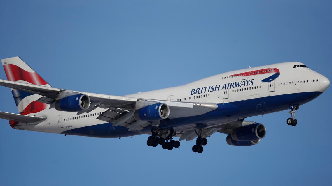 In this photograph taken late Monday, Feb. 8, 2016, a British Airways plane lands on a runway at Denver International Airport. (AP Photo/David Zalubowski)
