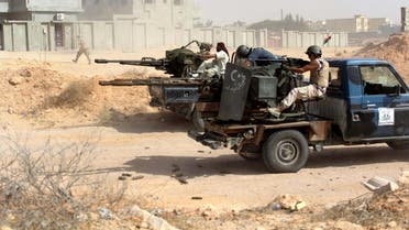 Fighters from forces aligned with Libya's new unity government fire anti-aircraft guns from their vehicles at ISIS positions in Algharbiyat area, Sirte, June 21, 2016 (Photo: Reuters)