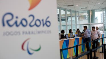 People buy Olympic tickets at a shopping mall in Rio de Janeiro, Brazil, Monday, June 20, 2016. Two ticket offices opened providing tickets for the Rio 2016 Olympic and Paralympic Games. In the coming weeks, more than 30 offices will start operating in Rio as well as in the five cities where Olympic football matches will take place. (AP Photo/Silvia Izquierdo)