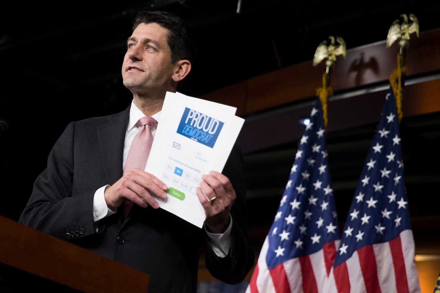 House Speaker Paul Ryan of Wis. holds up a fundraising form for House Democrats as he comments on the ongoing sit-in. (AP)