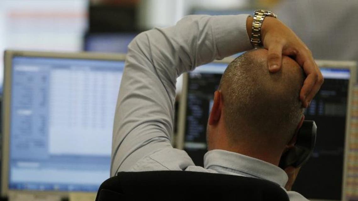 A trader from ETX Capital works in central london on June 24, 2015 following the announcement of the results of the EU referendum. (AFP)