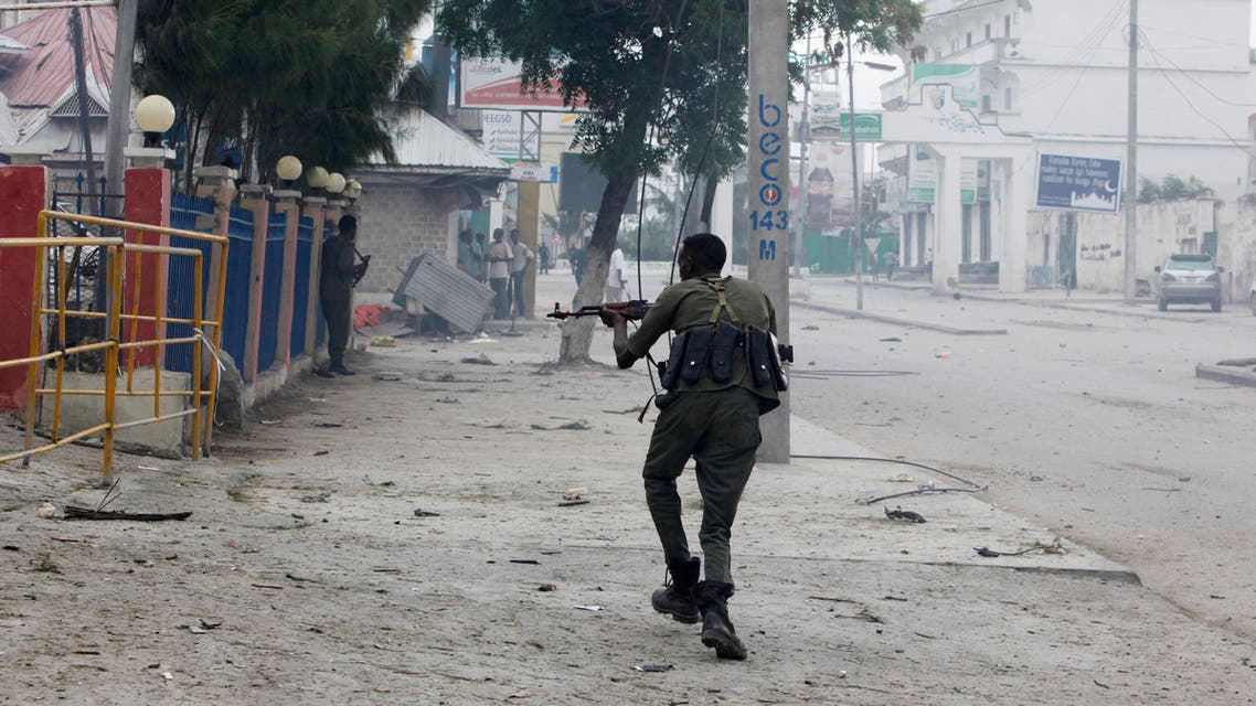 A Somali soldier takes position during an attack on Nasahablod Hotel, in Mogadishu, Somalia, Saturday, a June 25, 2016 . AP