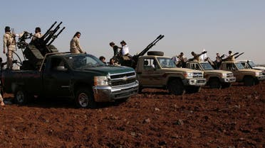 Rebel fighters from 'Mujahideen Horan brigade' stand on pick-up trucks mounted with anti-aircraft weapons as they take part in military training in the western rural area of Deraa Governorate, Syria June 19, 2016. REUTERS
