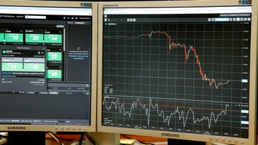 Screens, one which displays the rate of the British pound which drops against the US dollar (R) after the British referendum, are seen in a trading room in Paris, France, June 24, 2016. REUTERS