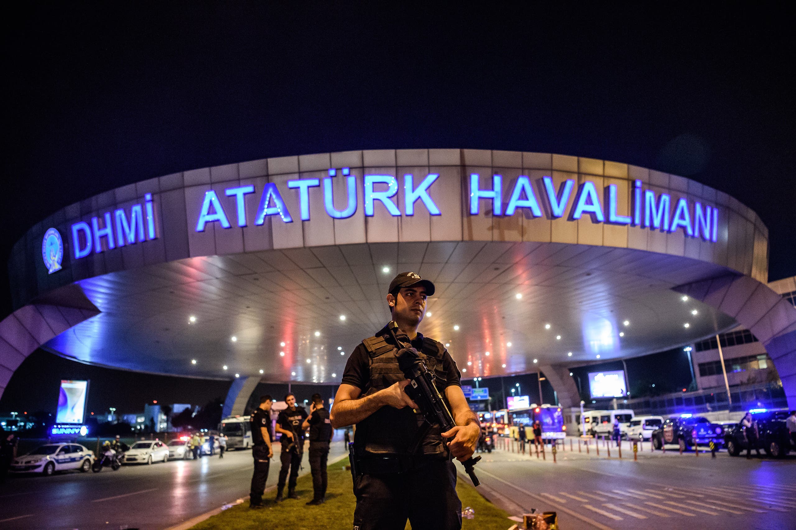 A Turkish riot police officer patrols Ataturk airport`s main enterance in Istanbul, on June 28, 2016, after two explosions followed by gunfire hit Turkey's largest airport. (AFP)