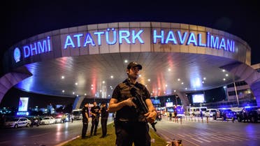 A Turkish riot police officer patrols Ataturk airport`s main enterance in Istanbul, on June 28, 2016, after two explosions followed by gunfire hit Turkey's largest airport. (AFP)