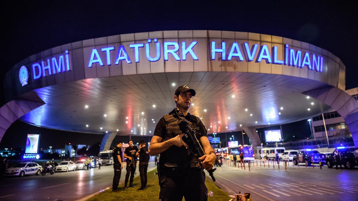 A Turkish riot police officer patrols Ataturk airport`s main enterance in Istanbul, on June 28, 2016, after two explosions followed by gunfire hit Turkey's largest airport. (AFP)