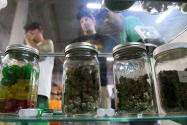 People look at jars of marijuana at the medical marijuana farmers market at the California Heritage Market in Los Angeles, California July 11, 2014. (Reuters)