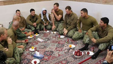 This picture released by the Iranian Revolutionary Guards on Wednesday, Jan. 13, 2016, shows detained American Navy sailors in an undisclosed location in Iran.  (AP)