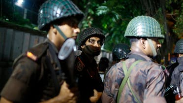 Bangladeshi security personnel stand guard near a restaurant that was attacked by unidentified gunmen in Dhaka, Bangladesh (Photo: AP)