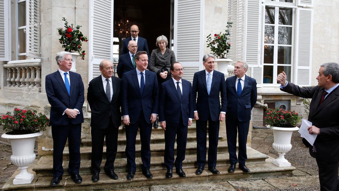 Britain's Secretary of State for Defence Michael Fallon, French Defence Minister Jean-Yves Le Drian, Britain's Prime Minister David Cameron, French President Francois Hollande, Britain's Foreign Secretary Phillip Hammond and French Foreign Minister Jean-Marc Ayrault pose as (top L-R) French State Secretary for European Affairs Harlem Desir, French Interior minister Bernard Cazeneuve and Britain's Home Secretary Theresa May (Reuters)
