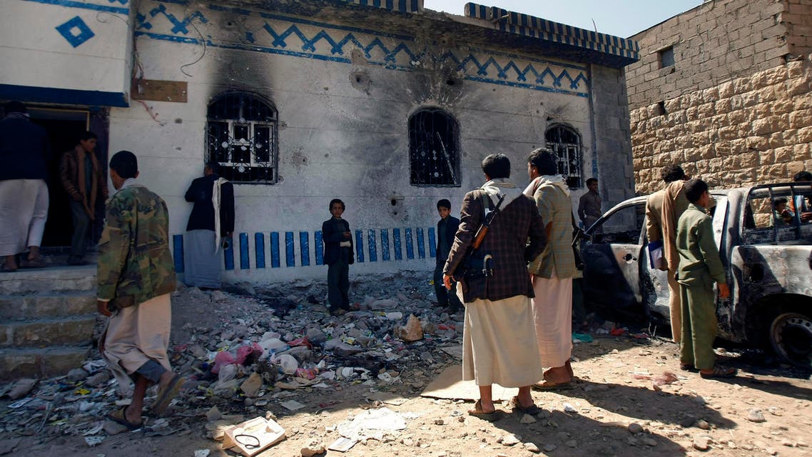 Yemenis look at a building damaged during a police raid on a hideout of al-Qaida militants in Arhab region, north of Sanaa, Yemen. (File photo: AP)