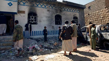 Yemenis look at a building damaged during a police raid on a hideout of al-Qaida militants in Arhab region, north of Sanaa, Yemen. (File photo: AP)