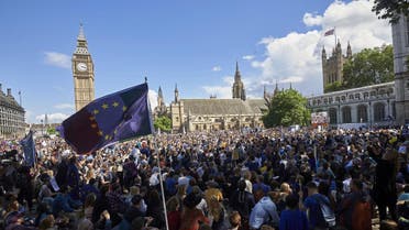 A European flag is flown as thousands of protesters gather in Parliament Square as they take part in a March for Europe, through the centre of London on July 2, 2016, to protest against Britain's vote to leave the EU, which has plunged the government into political turmoil and left the country deeply polarised. Protesters from a variety of movements march from Park Lane to Parliament Square to show solidarity with those looking to create a more positive, inclusive kinder Britain in Europe. Niklas HALLE'N / AFP