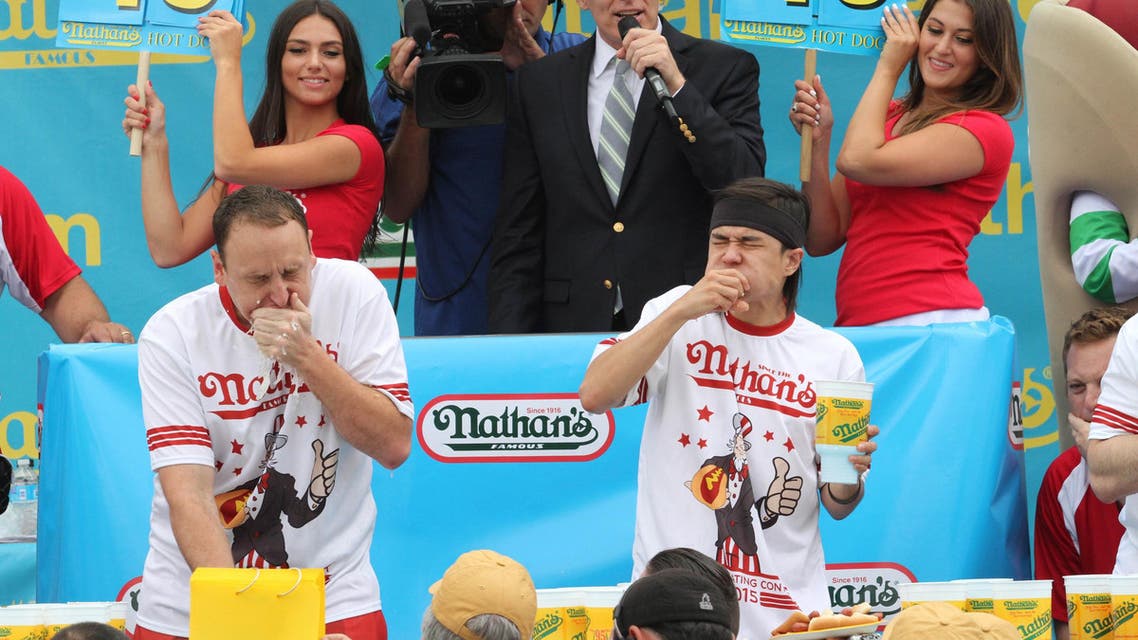 Joey Chestnut, left, and Matt Stonie compete in Nathan's Famous Fourth of July International Hot Dog Eating Contest men's competition Saturday in the Coney Island section in the Brooklyn borough of New York. (File photo: AP)