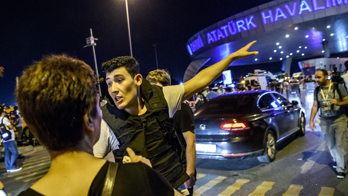 A Turkish police officer directs a passenger at Ataturk airport in Istanbul June 28, 2016 after two explosions followed by gunfire hit Turkey's biggest airport (Photo: Ozan Kose/AFP)