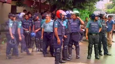 Police gather after gunmen attacked the Holey Artisan restaurant and took hostages early on Saturday, in Dhaka, Bangladesh. (Reuters)