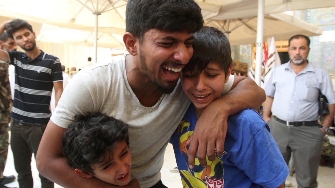 Mourners react during a funeral of a victim who was killed in a suicide car bomb in the Karrada shopping area in Baghdad, during the funeral in Najaf, south of Baghdad, Iraq, July 3, 2016.
