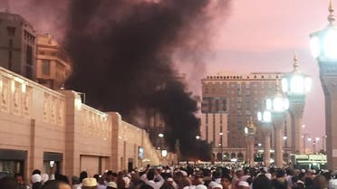 In this photo provided by Noor Punasiya, people stand by the explosion site in Madina, Saudi Arabia, Monday, July 4, 2016 (Photo: Courtesy of Noor Punasiya via AP)