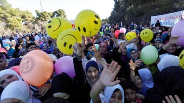 Muslim children race to get balloons after the prayers of Eid al-Fitr marking the end of the holy fasting month of Ramadan in Amman, Jordan, July 6, 2016. (Reuters) 