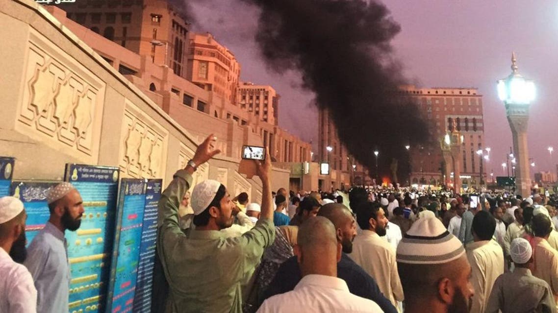 In this photo provided by Noor Punasiya, people stand by an explosion site in Madinah, Saudi Arabia, Monday, July 4, 2016. (AP)