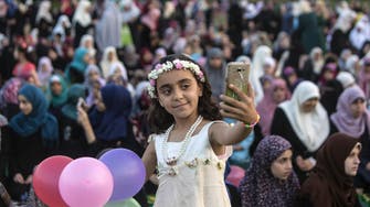 Muslims celebrate Eid, marking Ramadan's end