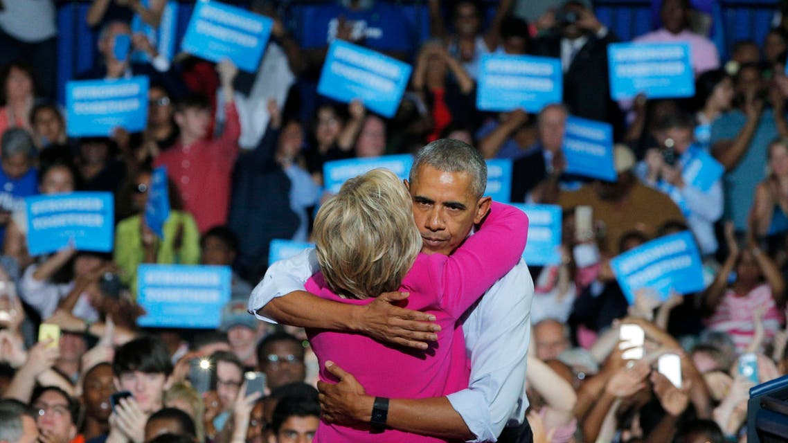 U.S. President Barack Obama embraces Democratic U.S. presidential candidate Hillary Clinton during a Clinton campaign event in Charlotte, North Carolina, U.S., July 5, 2016. REUTERS/Brian Snyder