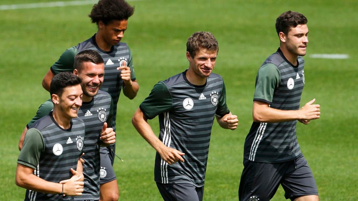 Germany's Mesut Oezil, Lukas Podolski, Thomas Mueller and Jonas Hector during training. REUTERS